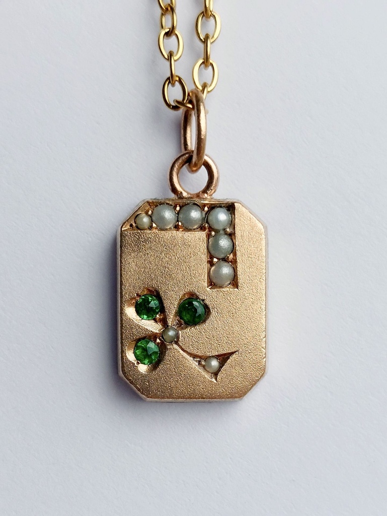 Edwardian 9k rose gold clover charm with seed pearls and green stones