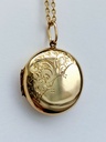 Edwardian 9ct B&F round locket with floral engravings
