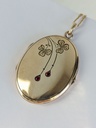 Art Nouveau Oval Locket with red rhinestones and clovers