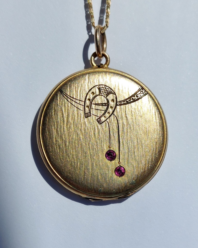 Art Nouveau horseshoe locket with ruby pastes