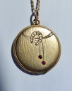 Art Nouveau horseshoe locket with ruby pastes