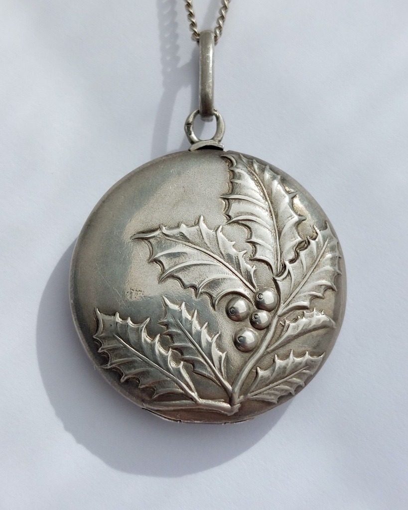 Antique holly silver locket in repoussé