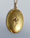 Art Nouveau oval clover pendant with ruby pastes